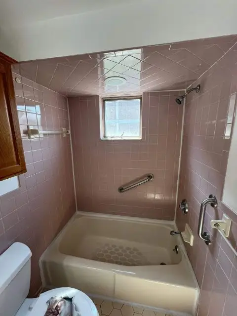 Before image of a bathroom awaiting a stylish remodel to enhance its functionality and aesthetics.