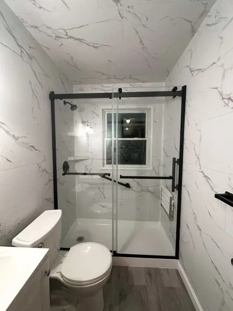 After photo showcasing a beautifully remodeled bathroom with elegant design.
