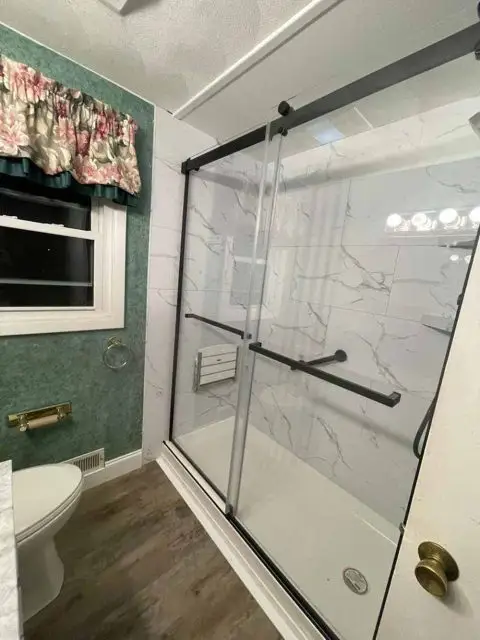 Beautifully remodeled bathroom showcasing modern design and luxurious features for relaxation.