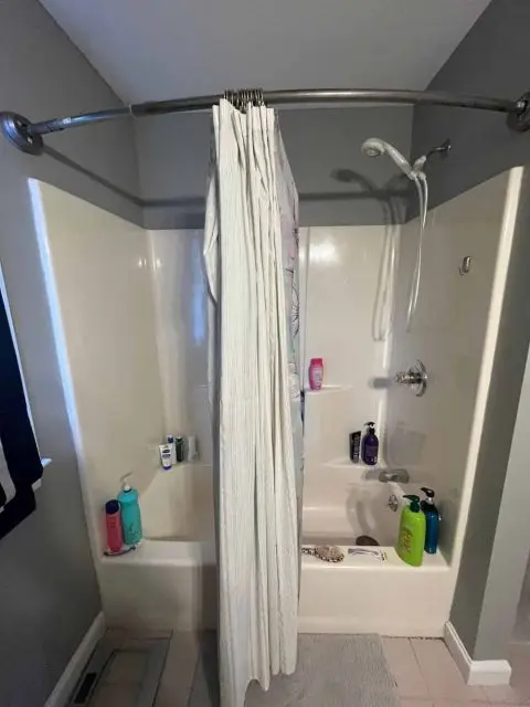 Before image showing an outdated bathroom with old fixtures awaiting a stylish remodel.