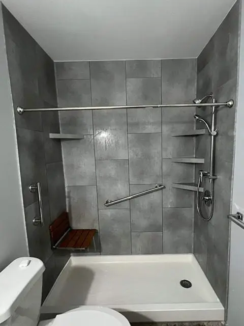Stunning after photo of a bathroom remodel featuring stylish decor and functionality.