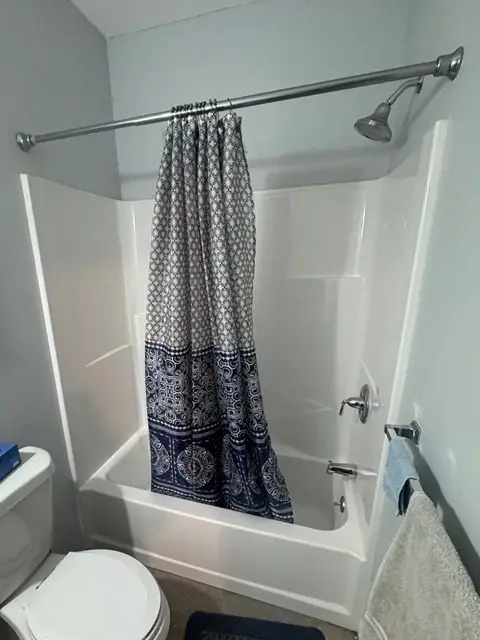 Before image of a dated bathroom in need of renovation and modern updates.