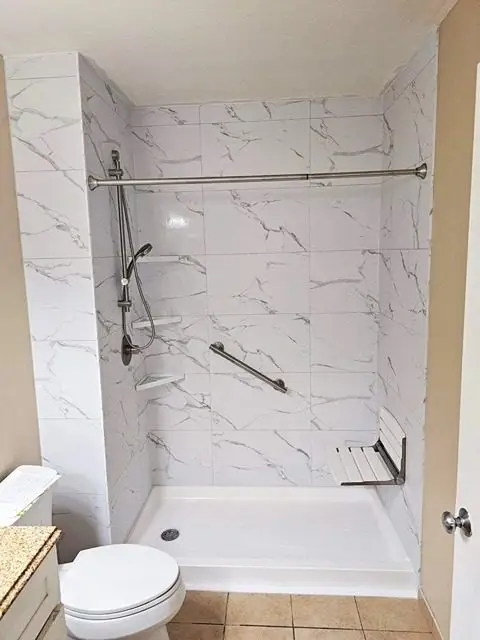 Beautifully remodeled bathroom showcasing modern design and luxurious finishes.