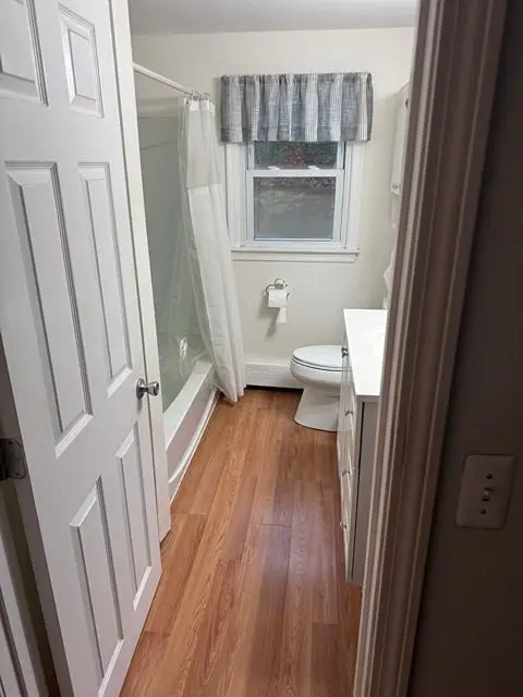 Before image of a dated bathroom in need of renovation and style update.