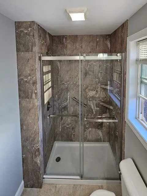 Gorgeous after photo of a newly remodeled bathroom with modern amenities.