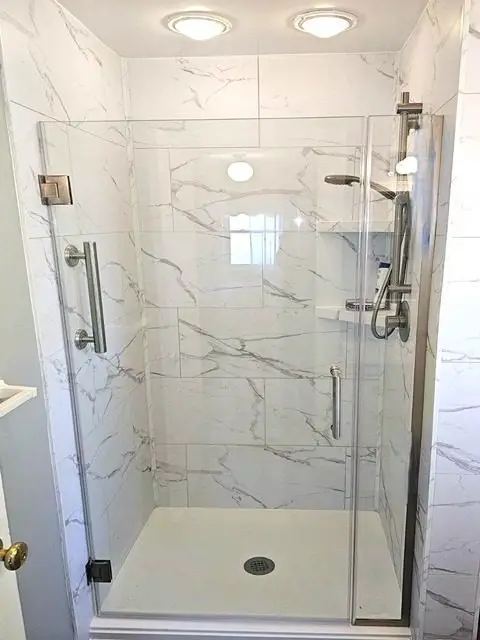 After bathroom remodel showcasing a stylish and functional space with modern amenities.